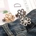 Metal hollow flower waist buckle no nail pants to make the waist smaller artifact skirt waist button_ipsvogv.com