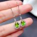 Cao Shi's earrings are simple and elegant, with green zircon long and elegant earrings._ipsvogv.com