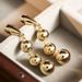 Gold-Plated Copper Minimalist Style Three Glossy Ball Tassel Earrings High-End Creative Round Bead Ear Cuffs For Women_ipsvogv.com