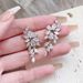Cao Shi Luxurious Super Sparkling with Leaf Style Design Sense Long Wisteria Flower Exquisite Earrings for Women_ipsvogv.com