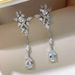 Cao Shi's Long Light Luxury Flower High-end Feeling Earrings Water Droplet Shaped Horse Eye Pendant_ipsvogv.com