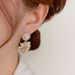 Korean Style Unique Exquisite Metal Fireworks Light Luxury Niche Design Super Shiny Dongdaemun High-end Fashion Earrings_ipsvogv.com