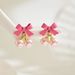 2024 minimalist new bow women's personality inlaid with pearls series pink earrings versatile ear accessories_ipsvogv.com