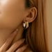 Gold and silver contrasting design personality earrings K real gold plated niche metal texture cross twist earrings_ipsvogv.com