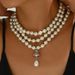 Light luxury style women's pearl with multiple layers, simple and niche design, diamond studded long collarbone chain_ipsvogv.com