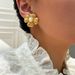 Fashionable Ins Plated Titanium Steel Retro Embossed Flower Pearl Earrings_ipsvogv.com