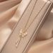 Cat's Eye Bow Tassel Titanium Steel Necklace High end Light Luxury Micro Zirconium Embedding 2023 Summer New Style with_ipsvogv.com