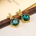 Qingdao jewelry emerald crystal micro inlaid zircon butterfly ethnic style women's earrings niche high-end feeling_ipsvogv.com