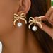 version of Korean style new bow with female personality pearl inlaid design earrings, versatile and high-end earrings_ipsvogv.com
