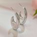 Trendy U-shaped earrings for women with gold oval stud earrings_ipsvogv.com