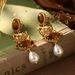 Court Style Russian Gold Niche New Medieval Earrings Tassels Inlaid Pearls Tiger Eye Design High End Earrings_ipsvogv.com