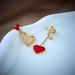 Unisex new creative personality niche asymmetrical hollow love titanium steel hanging earrings_ipsvogv.com