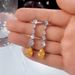 Cao Shi's Korean Edition New Pear Water Drop Shaped Zircon Long Tassel Fashion Women's Earrings_ipsvogv.com