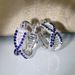 Cao Shi's Advanced Sense Treasure Blue Zircon Earrings with Korean Version Temperament and Personality Cross Hip Hop Style Earrings_ipsvogv.com