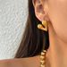 Spot Fashionable Niche INS Titanium Vintage Peach Heart Embossed Symmetrical Versatile Earrings_ipsvogv.com
