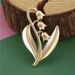 White orange tea, lily of the valley high-end exquisite women's electroplated matte gold brooch, niche design, elegant_ipsvogv.com