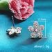Cao Shi's Korean version is simple and slightly inlaid with diamonds, zircon earrings, lucky grass flowers, small and elegant ear ornaments_ipsvogv.com