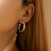 Gold and silver contrasting design personality earrings K real gold plated niche metal texture cross twist earrings_ipsvogv.com
