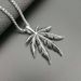 Hip Hop Jewelry Titanium Steel Color-Retaining Gold-Plated Jamaican Reggae Maple Leaf Pendant_ipsvogv.com