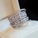 Cao Shi's Multi-layered Ring Is A Unique Niche Accessory For Women, Featuring Fashionable And Shiny Zircon Design_ipsvogv.com