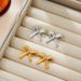 Unisex New Three Dimensional Ripple Bow Retro Earrings Copper Crossing Bow Sweet Ear Hook Light Luxury Temperament Earrings_ipsvogv.com