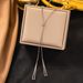 2023 New High-quality Korean Gold Triangle Tassel Pull-out Titanium Steel Collarbone Chain Does Not Fade_ipsvogv.com