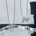 Autumn New Korean Silver-Plated Matte Silver Ribbon Bowknot Dynamic Pearl Necklace Sweater Chain For Women With High-End_ipsvogv.com