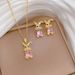 【 Titanium Steel 】 Necklace Earring Light Luxury Curved Rabbit Full Diamond Personalized Temperament Banquet Earrings_ipsvogv.com