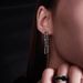 Subtle metal with cold cool style, featuring a minimalist design and exaggerated titanium steel long earrings_ipsvogv.com