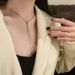 2023 New High-quality Korean Gold Triangle Tassel Pull-out Titanium Steel Collarbone Chain Does Not Fade_ipsvogv.com