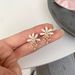 Korean flower pearl simple temperament unique niche high end design fairy earrings price adjustment_ipsvogv.com