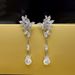 Cao Shi's Long Light Luxury Flower High-end Feeling Earrings Water Droplet Shaped Horse Eye Pendant_ipsvogv.com