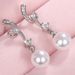 Cao Shi Synthetic Mother Shell Pearl Earrings Elegant and Exquisite Wave Pattern Earrings for Women's Long and Simple Earrings_ipsvogv.com