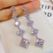 Cao Shi's square tassel long earrings, female face trimming, slimming, and versatile ear accessories_ipsvogv.com