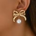 version of Korean style new bow with female personality pearl inlaid design earrings, versatile and high-end earrings_ipsvogv.com