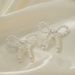 INS Simple Versatile Pearl Shell Bowknot For Women French Style High-end Handmade Woven Stud Earrings_ipsvogv.com