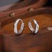 S999 Pure Silver Mobius Plain Hoop Earrings For Women Cold Style Twisted Line Personality Ear Buckle High End Earrings_ipsvogv.com