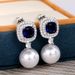 Caoshi's Popular Artificial Pearl Earrings with High Grade Feeling Inlaid Royal Blue Zircon Earrings_ipsvogv.com