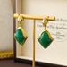 Vintage jewelry, water droplet arrow shaped green jelly glass light luxury, niche high-end earrings, autumn and winter_ipsvogv.com
