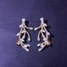 Hot-selling Jewelry Disordered Branch-shaped earrings Trendy Double Buckle Micro-inlaid Zircon earrings earrings_ipsvogv.com