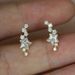 Cao Shi's earrings are copper plated with gold, shining with curved stars, versatile women's earrings_ipsvogv.com