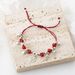 Hot Selling Handmade Ethnic Wind Chime Bell Lucky Character Pendant With Adjustable Red Rope Bracelet_ipsvogv.com