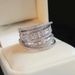 Cao Shi's Multi-layered Ring Is A Unique Niche Accessory For Women, Featuring Fashionable And Shiny Zircon Design_ipsvogv.com