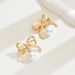 version of Korean style new bow with female personality pearl inlaid design earrings, versatile and high-end earrings_ipsvogv.com