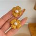 Fashionable Ins Plated Titanium Steel Retro Embossed Flower Pearl Earrings_ipsvogv.com