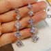 Cao Shi's square tassel long earrings, female face trimming, slimming, and versatile ear accessories_ipsvogv.com