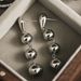 Gold-Plated Copper Minimalist Style Three Glossy Ball Tassel Earrings High-End Creative Round Bead Ear Cuffs For Women_ipsvogv.com