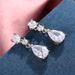 Cao Shi's Small Fresh Classic Droplet Earrings with Light Micro Pear Shaped Zircon Bridal Style Earrings for Women_ipsvogv.com
