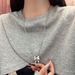 Autumn New Korean Silver-Plated Matte Silver Ribbon Bowknot Dynamic Pearl Necklace Sweater Chain For Women With High-End_ipsvogv.com