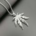 Hip Hop Jewelry Titanium Steel Color-Retaining Gold-Plated Jamaican Reggae Maple Leaf Pendant_ipsvogv.com